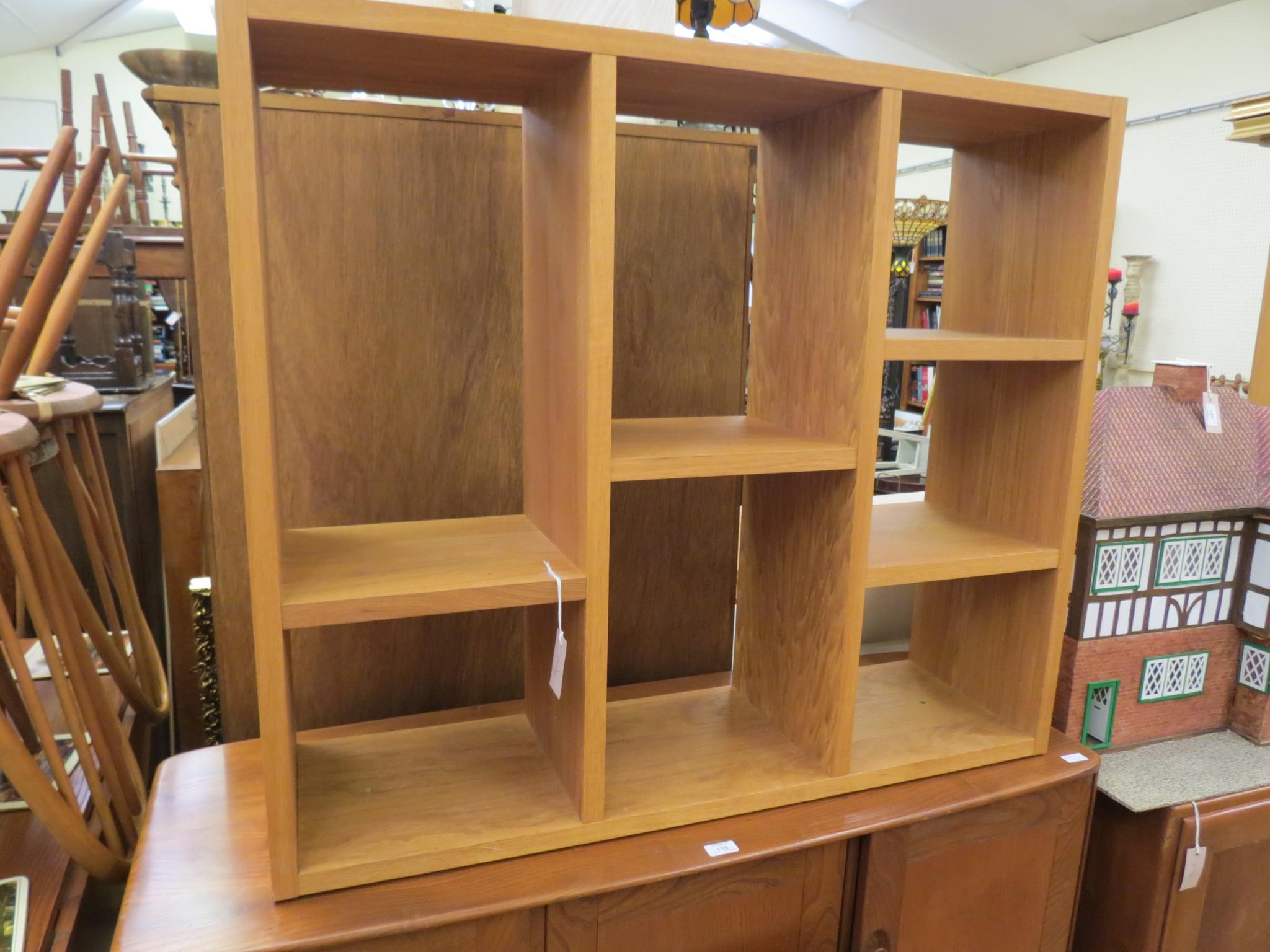 Appraisal: A Laura Ashley solid light oak bookcase with fitted open