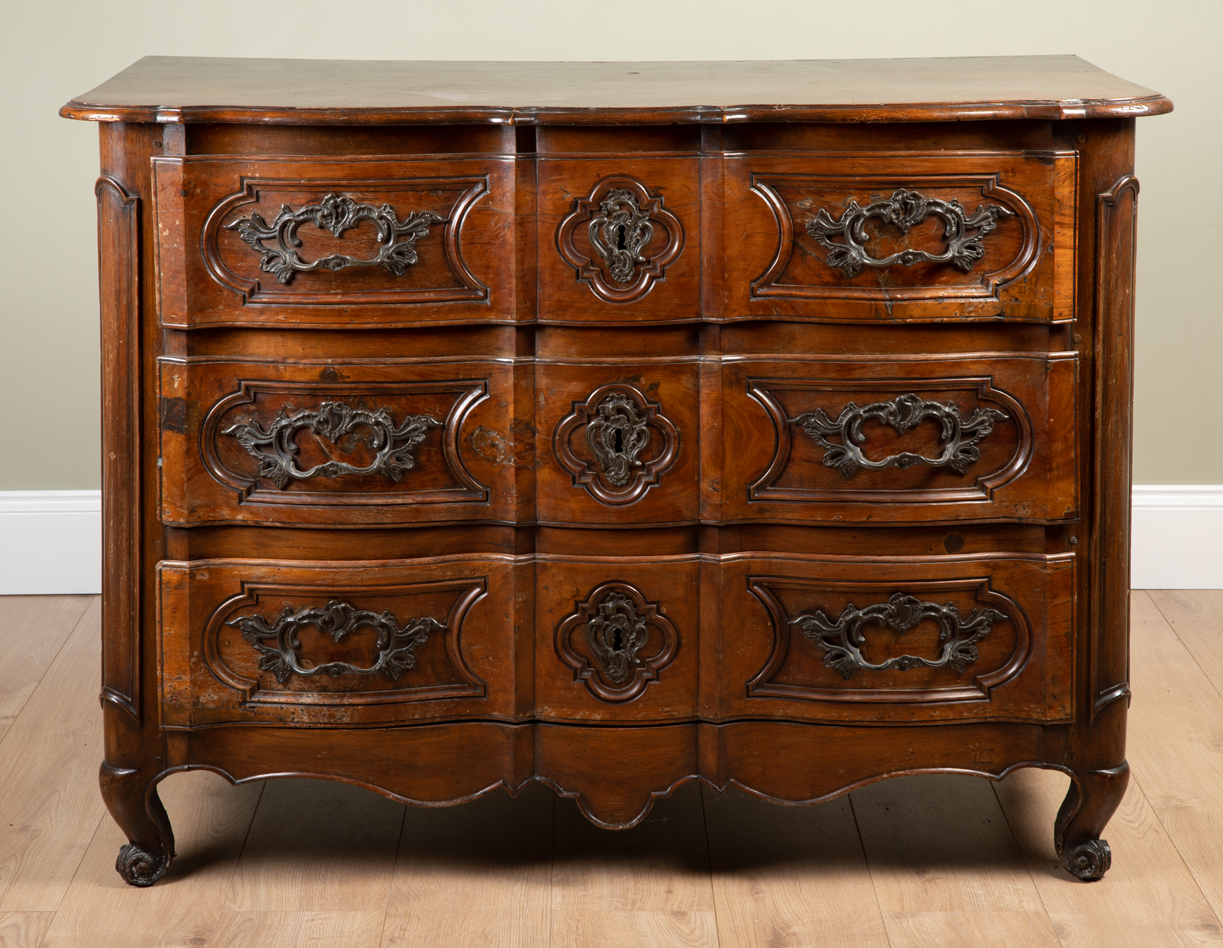 Appraisal: A th century French walnut three drawer commode with cast