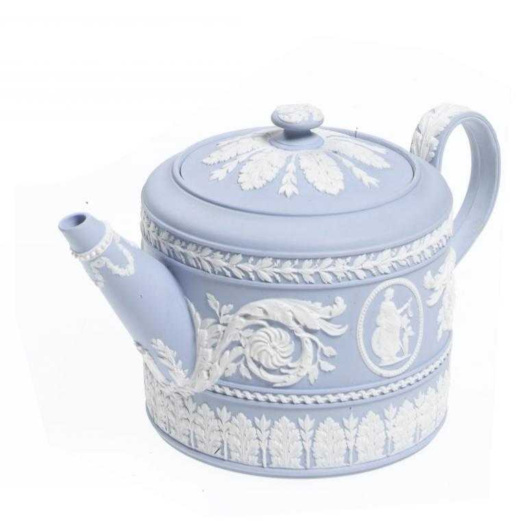 Appraisal: A WEDGWOOD LIGHT BLUE JASPER WARE TEAPOT AND COVER ornamented