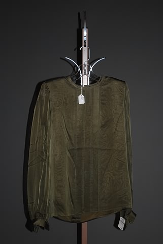 Appraisal: Andr Laug olive green sheer long-sleeve silk blouse Size M