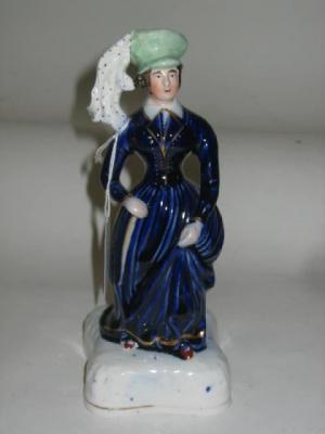 Appraisal: A STAFFORDSHIRE POTTERY FIGURE th century modelled as Queen Victoria