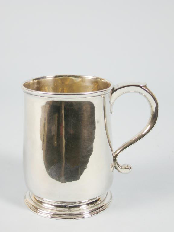 Appraisal: A George II small Mug with scroll handle London