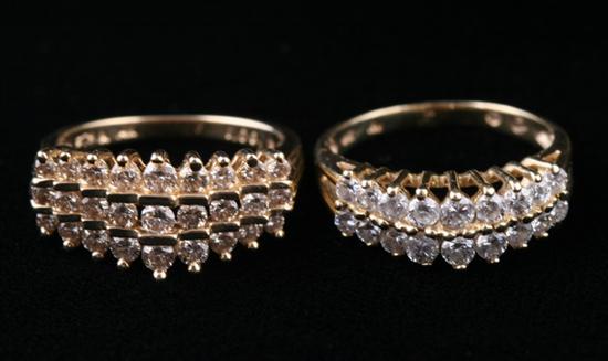 Appraisal: TWO K YELLOW GOLD AND DIAMOND ARCH FORM RINGS One