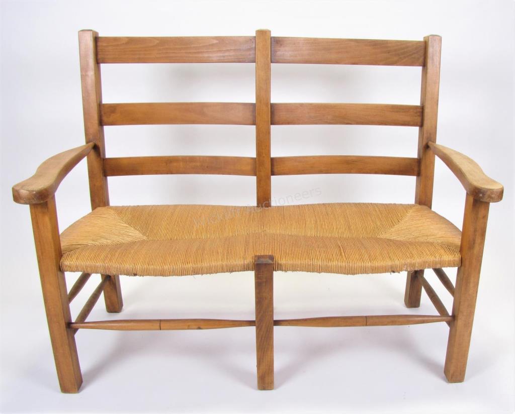 Appraisal: A country-style settee pine with rush seat ladder back connected