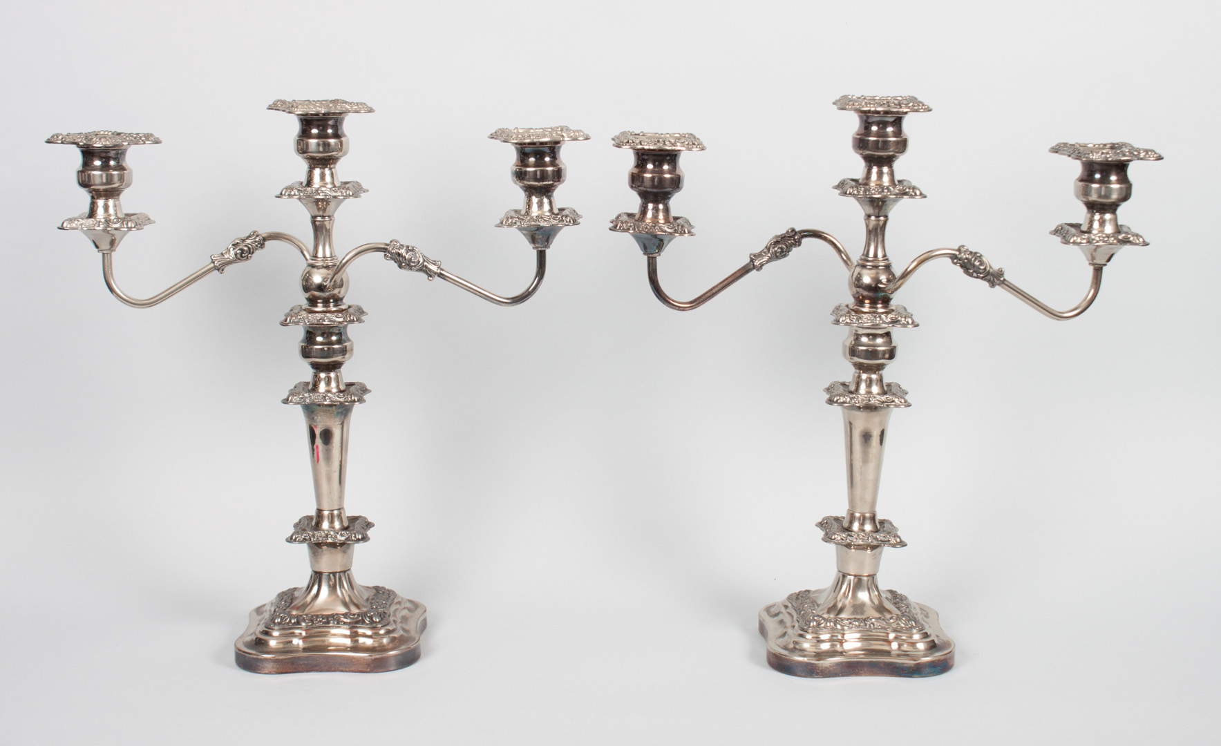 Appraisal: Pair of English silver-plated candelabra three-light repousse bobeches in H