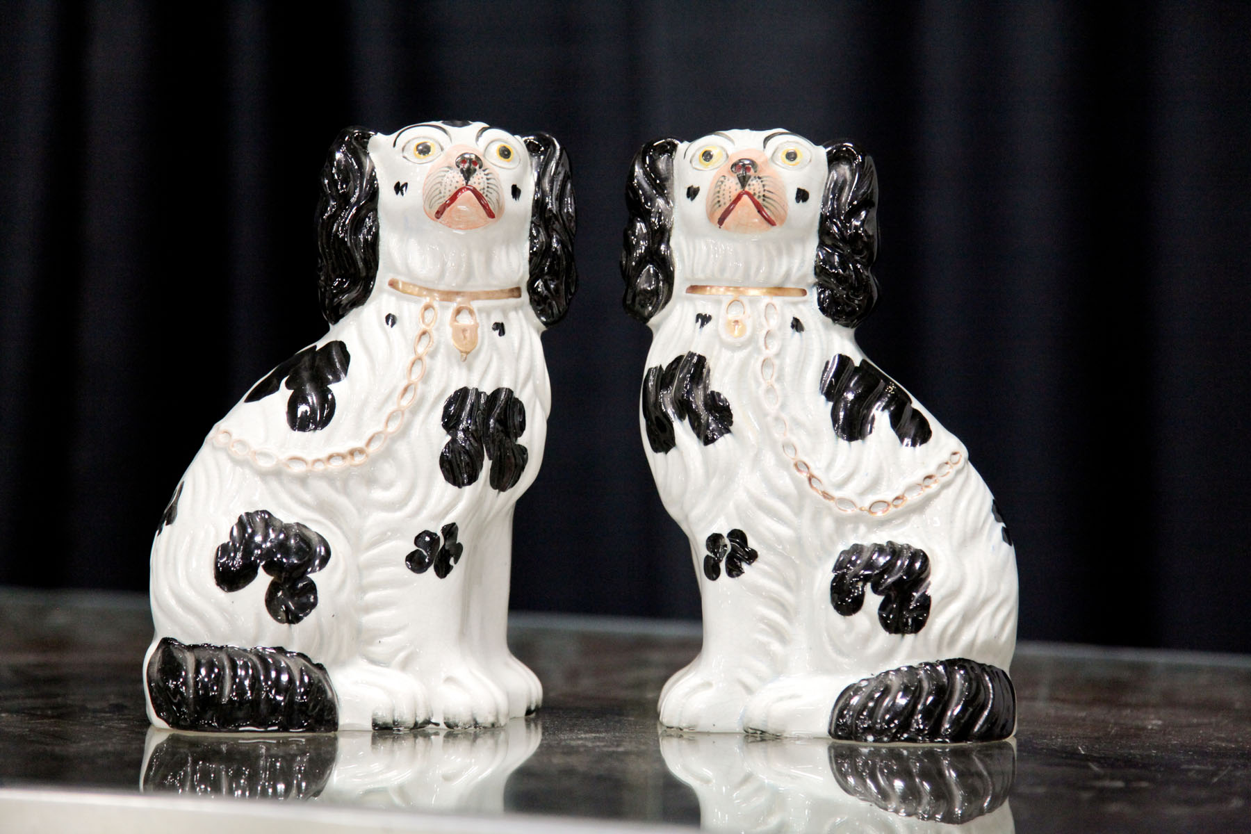 Appraisal: PAIR OF STAFFORDSHIRE DOGS England late th century Seated spaniels