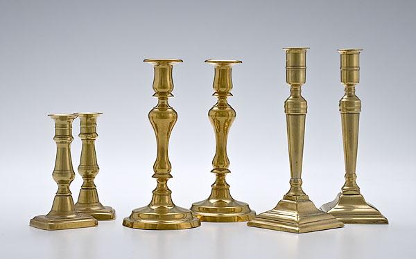 Appraisal: THREE PAIRS OF ENGLISH BRASS CANDLESTICKS two pairs of classical