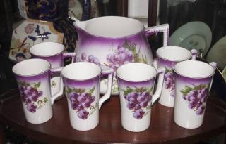 Appraisal: Semiporcelain Juice Pitcher and Cups with Handles Made by Edward