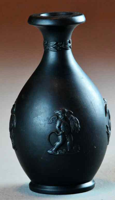 Appraisal: Wedgewood Black Basalt Bud VaseFinely molded to depict putti four