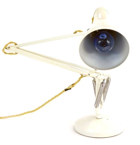 Appraisal: A white anglepoise desk lamp by Herbert Terry Sons of