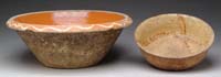 Appraisal: TWO PIECES OF SLIP DECORATED POTTERY Yellow glaze with brown