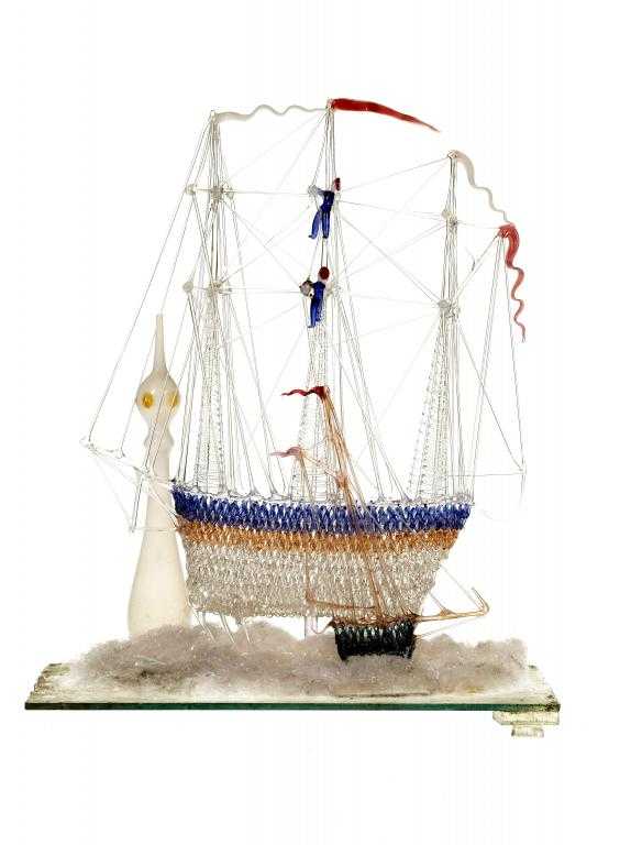 Appraisal: A VICTORIAN GLASS SHIP FRIGGER in clear blue and pink