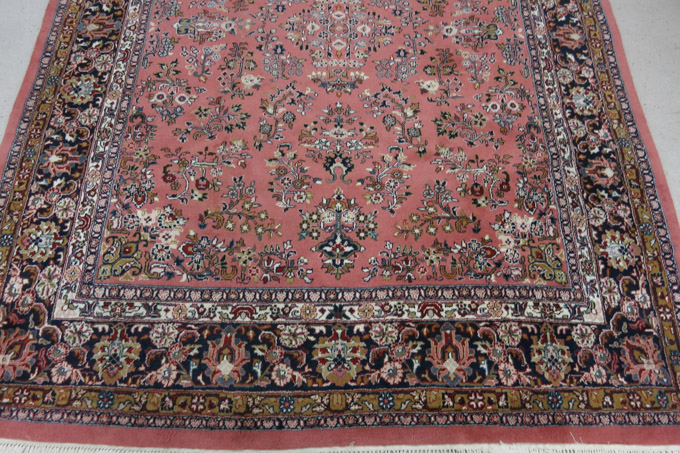 Appraisal: HAND KNOTTED ORIENTAL CARPET Indo-Sarouk floral spray pattern on rose