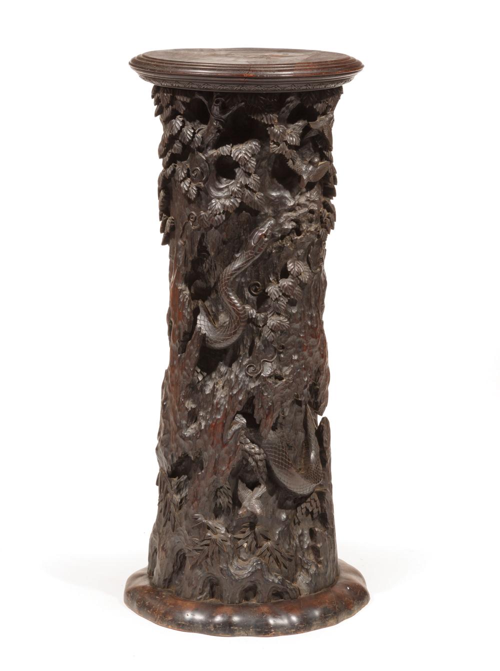 Appraisal: Antique Asian Hardwood Pedestal carved as the trunk of a