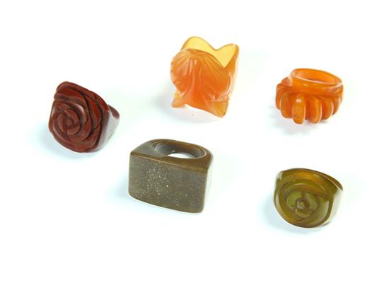 Appraisal: FIVE EARLY PLASTIC RINGS American Ca - One with carved