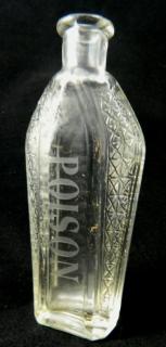 Appraisal: Poison Poison- clear coffin shaped 'Poison' etched on front corners