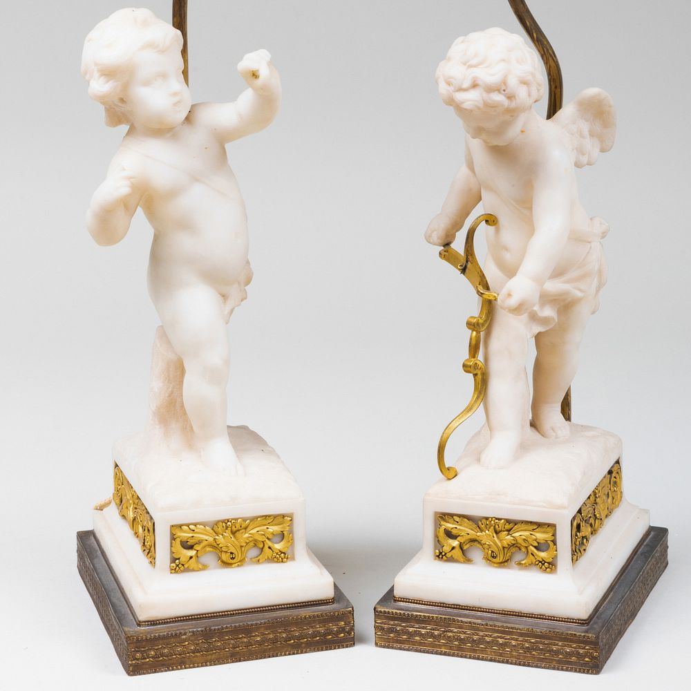 Appraisal: Pair of Gilt Metal Mounted Marble Putti Lamps x x