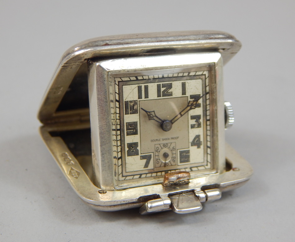 Appraisal: An Edward VIII Art Deco style silver cased small travelling