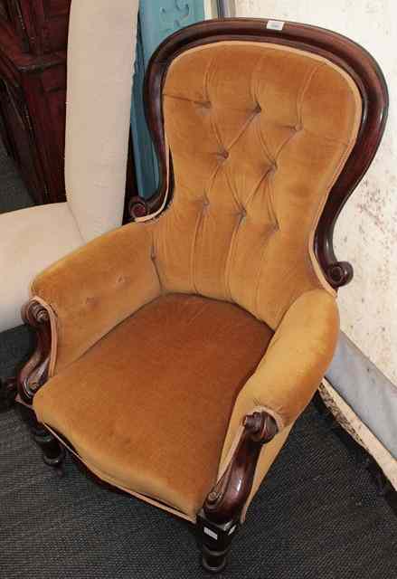 Appraisal: A VICTORIAN MAHOGANY ARMCHAIR with shaped scroll back turned legs