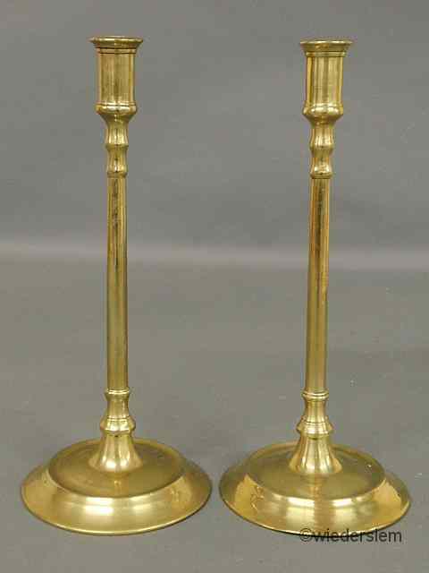 Appraisal: Pair of Continental brass candlesticks th c with circular bases