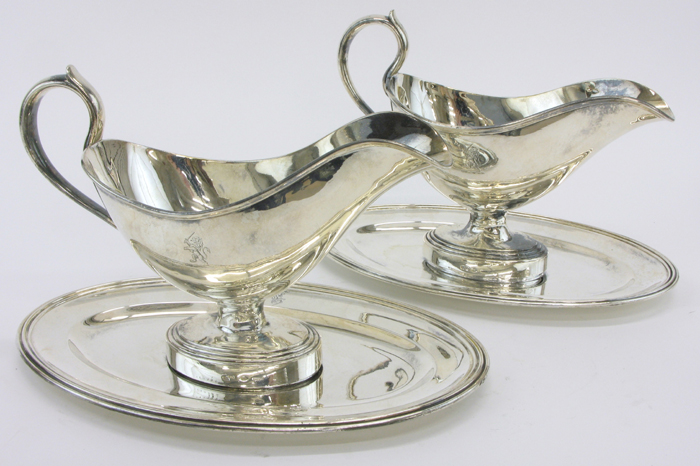 Appraisal: PAIR FRENCH CHRISTOFLE SILVER PLATED GRAVY BOATS with fitted underplates