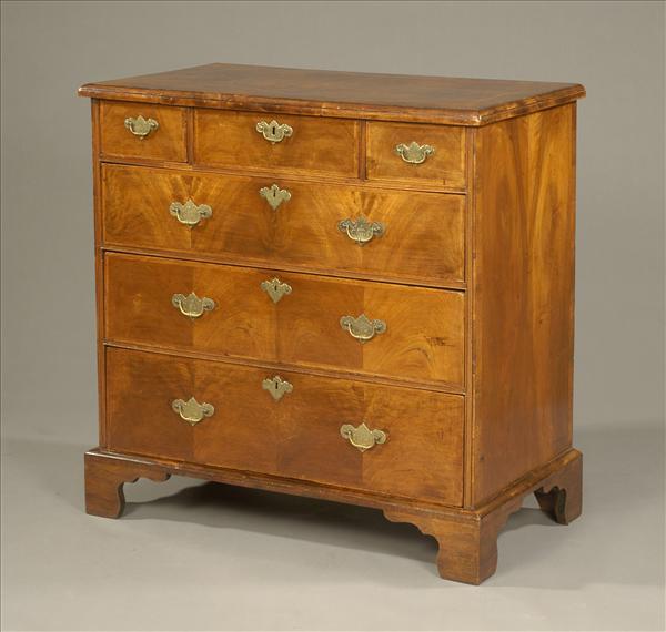 Appraisal: A walnut chest of drawers part early th century the