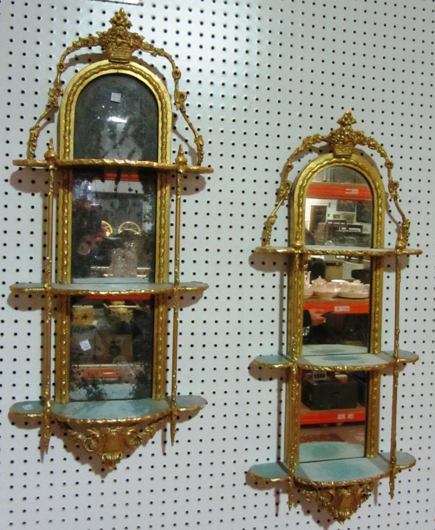 Appraisal: A pair of th century gilt pier mirrors with three