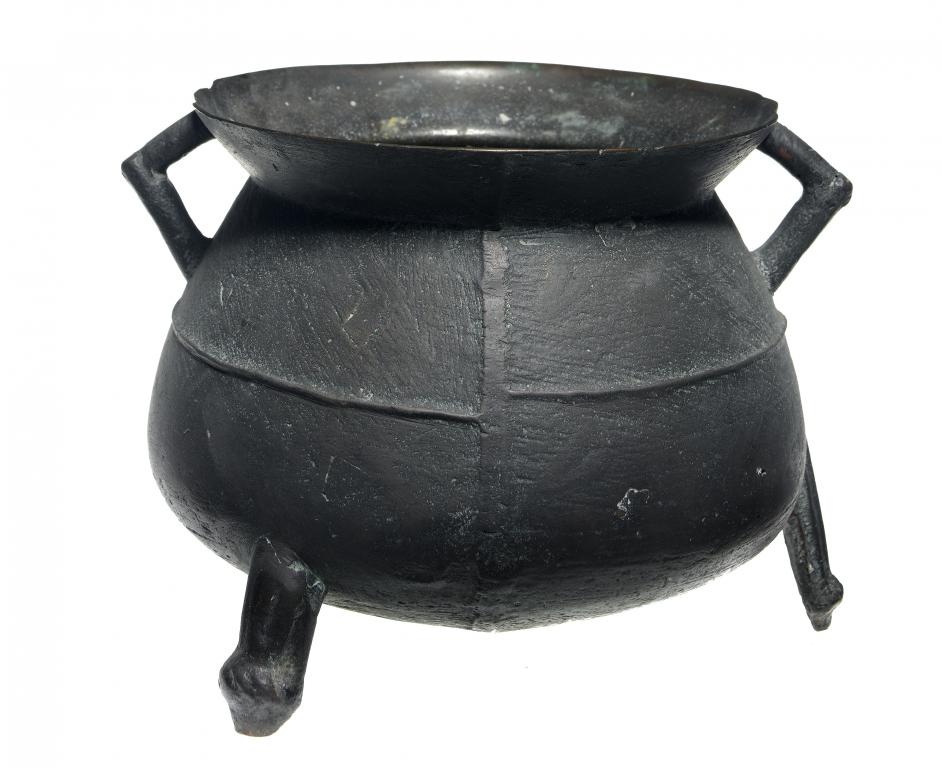 Appraisal: AN ENGLISH LEAD BRONZE COOKING POT OR CAULDRON the tapered