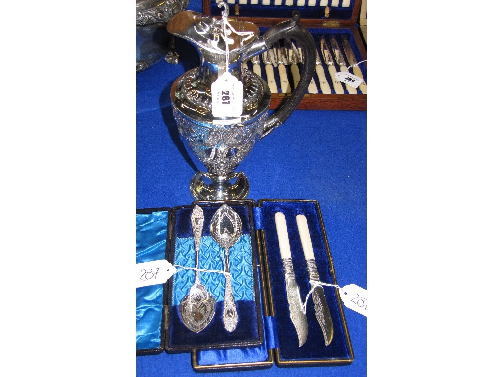 Appraisal: Lot comprising cased pair of butter knives and cased pair