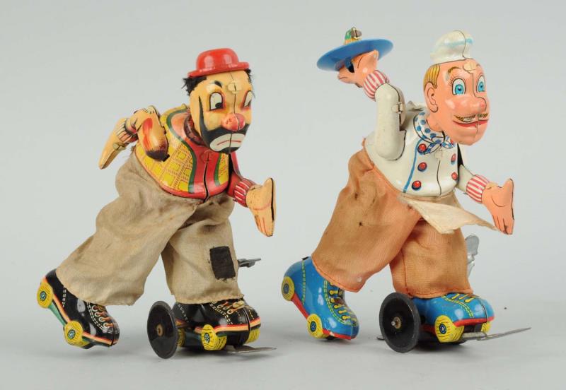 Appraisal: Lot Of Wind-Up Tin Roller Skater Toys Both are Japan