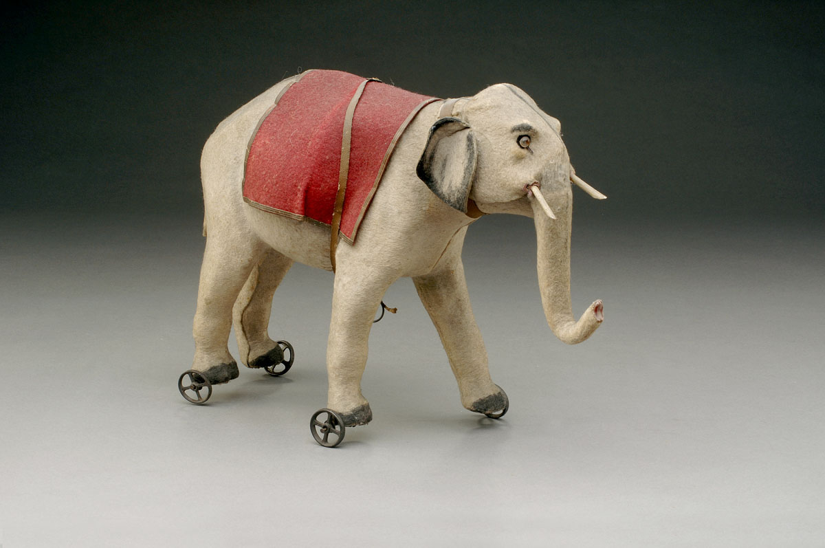 Appraisal: PAPIER MACHE FELT-COVERED AND PAINTED ELEPHANT SQUEAKER PULL-TOY POSSIBLY A