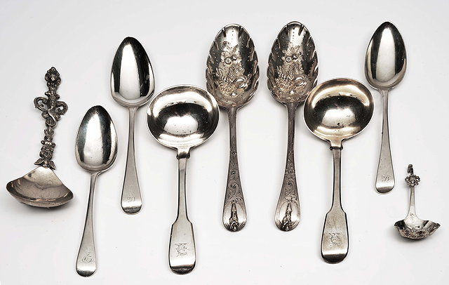 Appraisal: TWO TH CENTURY SILVER BERRY SPOONS two silver sauce ladels