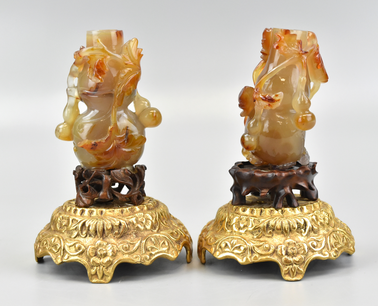 Appraisal: A pair of Chinese carved agate vases with double stands