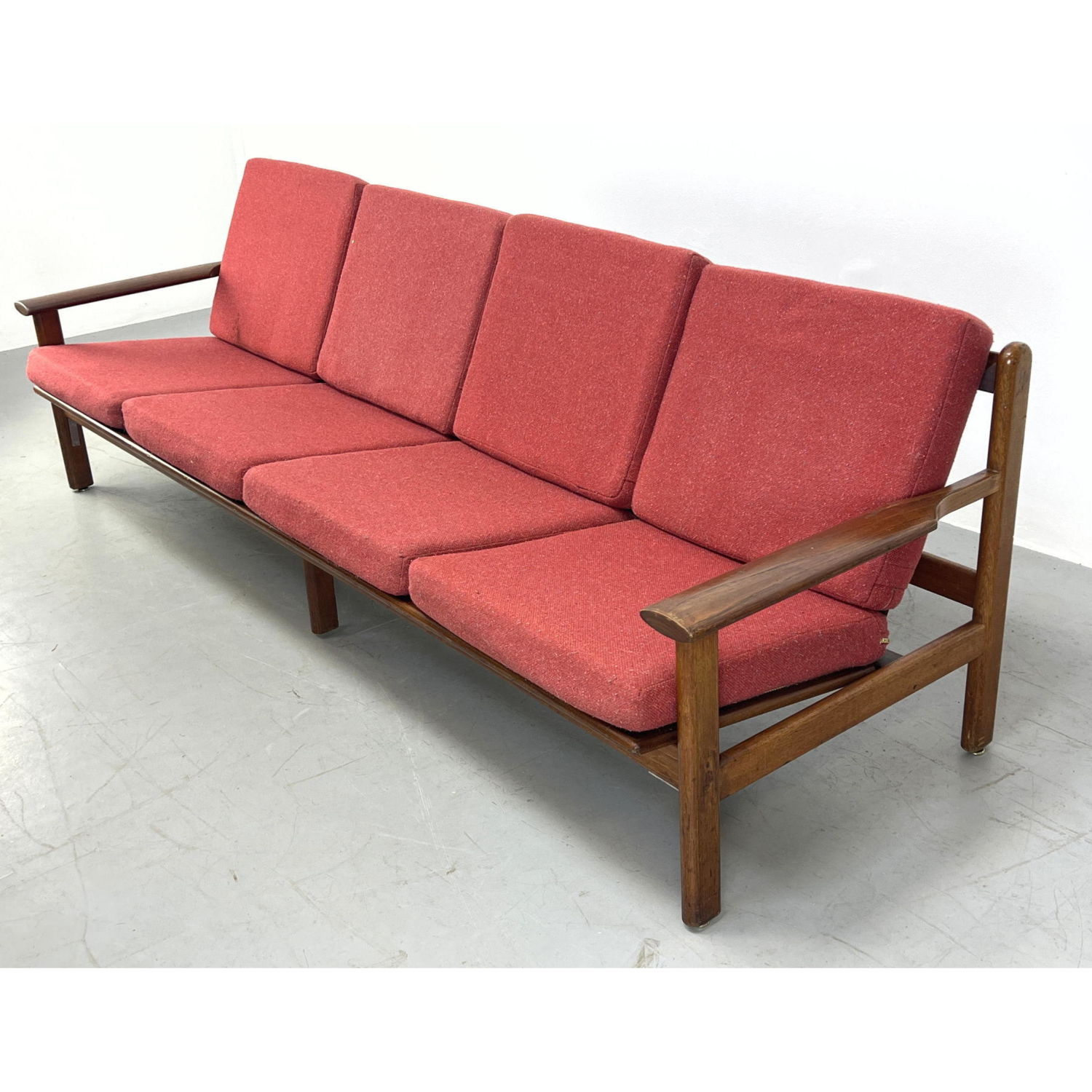 Appraisal: Long Modernist Wood Frame Sofa Couch Red Fabric Cushions Dimensions