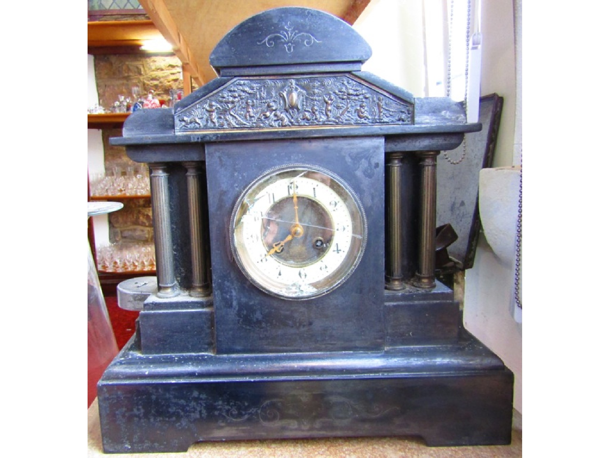 Appraisal: A Victorian black slate mantle clock in a classical style