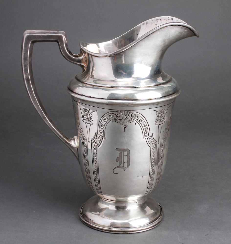 Appraisal: American Sterling Silver Engraved Water Pitcher American sterling silver engraved