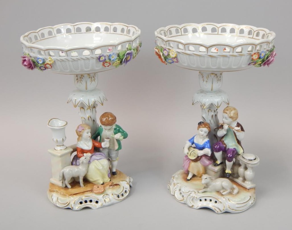 Appraisal: A pair of German porcelain handpainted centrepieces each with a