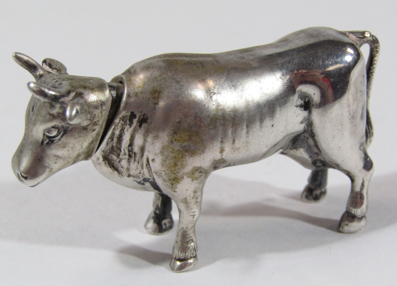 Appraisal: A bull shaped spice or salt dispenser with removable head