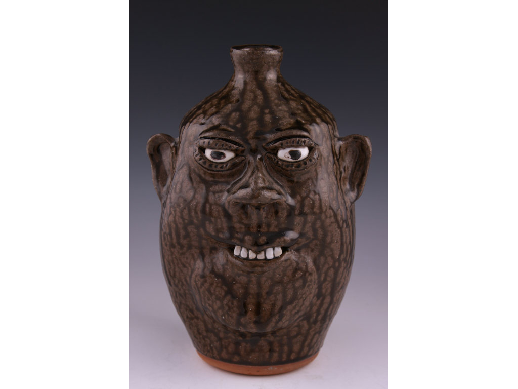 Appraisal: GA Folk Pottery Face Jug Cleater Billie Meaders consistent drippy