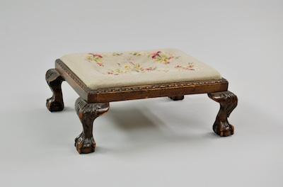 Appraisal: A Georgian Style Foot Stool With a floral design needlepoint