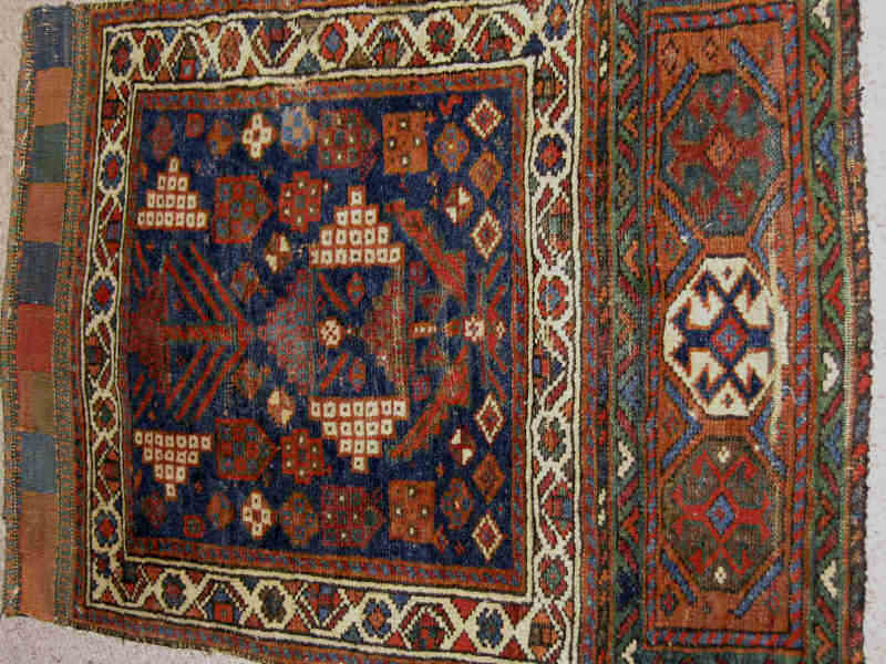 Appraisal: KURDISH BAGFACE Woven as two panels the larger top panel