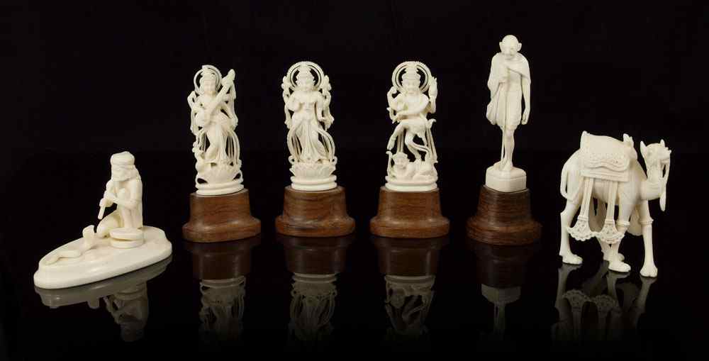 Appraisal: PIECE COLLECTION OF CARVED IVORY FIGURES To include Snake charmer