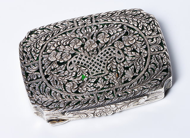 Appraisal: A CONTINENTAL SILVER AND GREEN ENAMELLED BOX the lid with