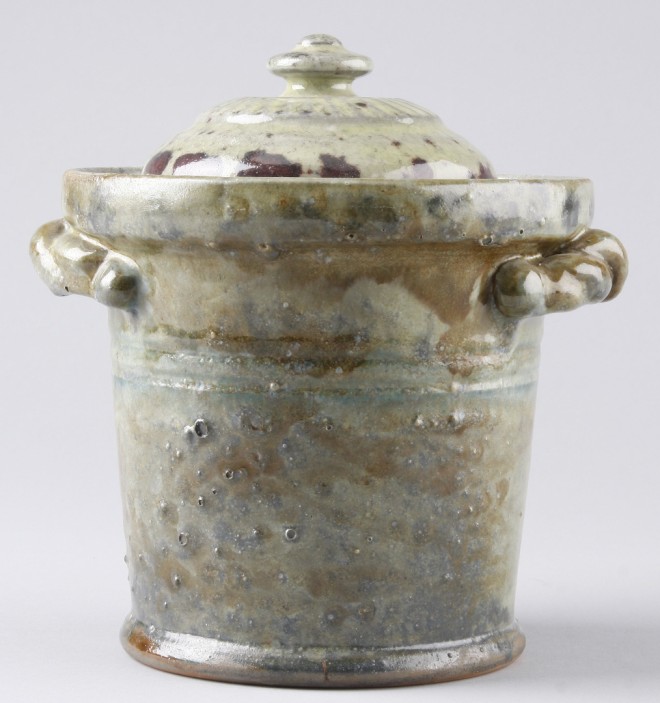 Appraisal: Lidded redware pot with light green and purple glaze t