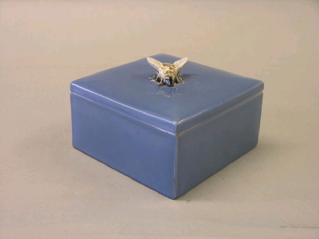 Appraisal: An earthenware honey box possibly Bretby glazed in blue monochrome