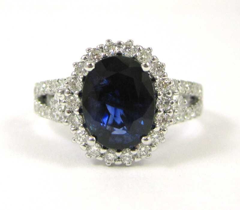 Appraisal: SAPPHIRE DIAMOND AND FOURTEEN KARAT WHITE GOLD RING with round-cut