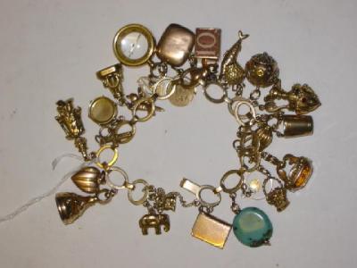 Appraisal: A CT GOLD FLAT SPECTACLE LOOP BRACELET hung with approximately