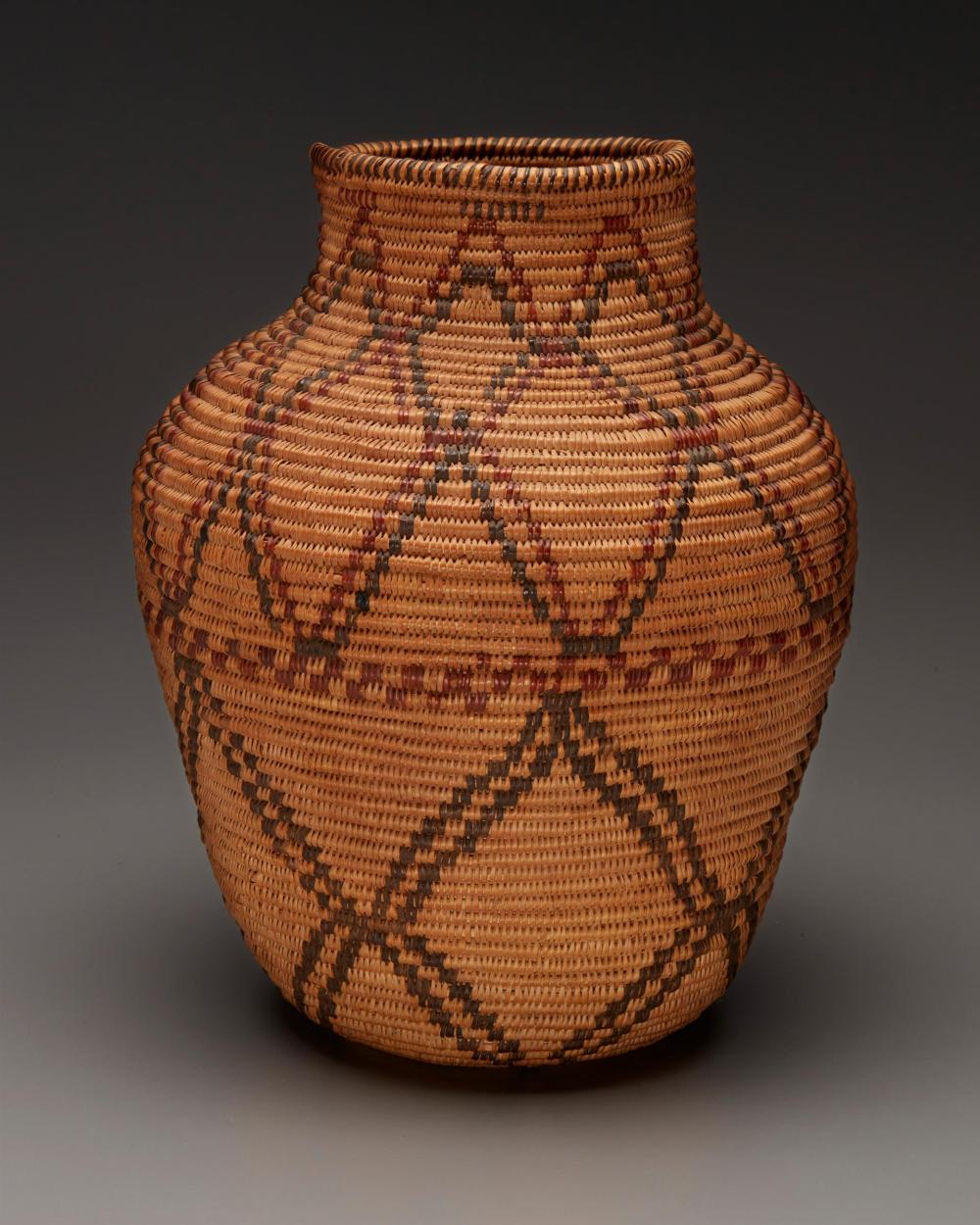 Appraisal: A polychrome Apache olla basket First-quarter th Century Southwest United