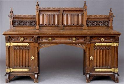 Appraisal: VICTORIAN GOTHIC REVIVAL BRASS-MOUNTED OAK SIDEBOARD The backboard with linen