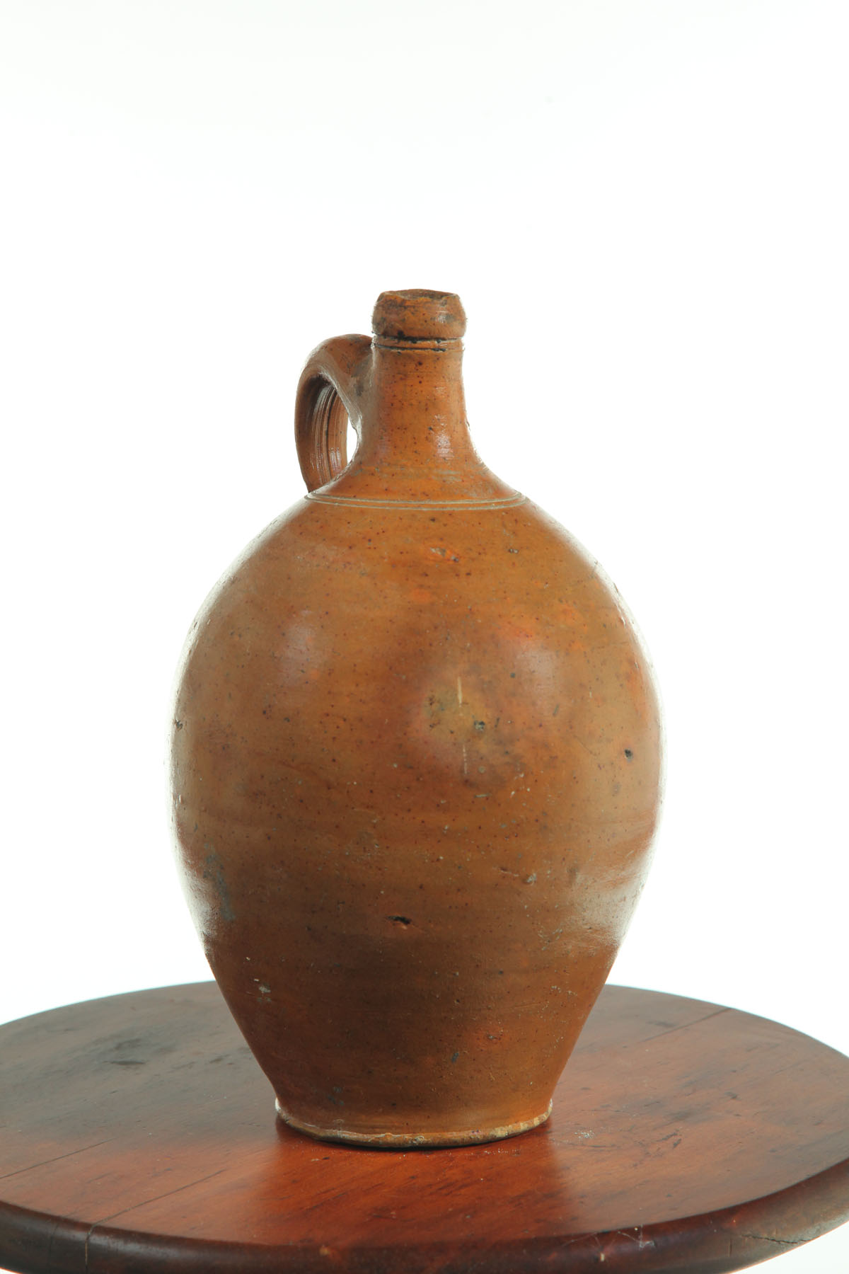 Appraisal: STONEWARE JUG American early th century Ovoid with applied handle